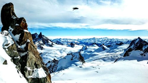 Scenic view of snow covered mountains