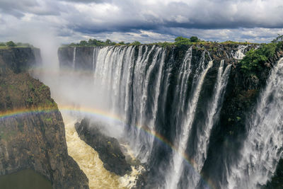 Panoramic view of waterfall against sky