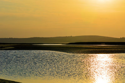 Scenic view of sea against sky during sunset