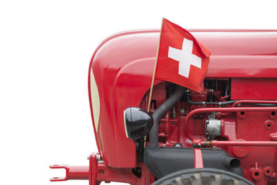 Close-up of swiss flag in land vehicle