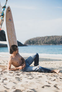 High angle view of man relaxing on beach