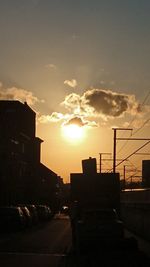 City against sky during sunset