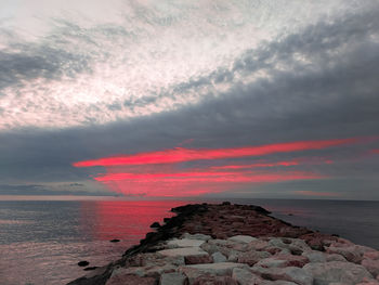 Scenic view of sea against sky during sunset, boulder jetty