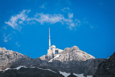 Low angle view of buildings against blue sky