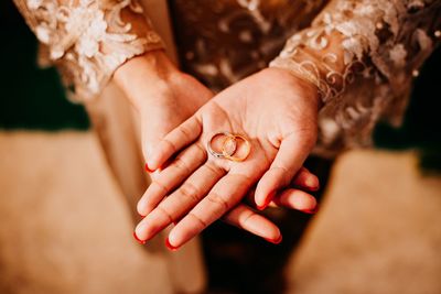 Close-up of woman holding hands