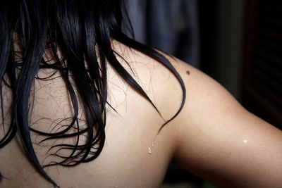 Midsection of woman with wet hair