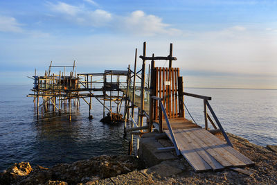 Pier on sea against sky