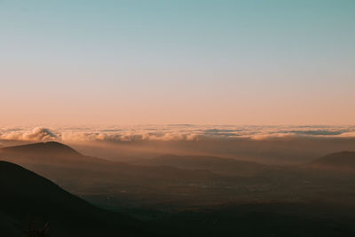 Scenic view of mountains against sky during sunset