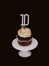 Close-up of cupcakes against black background