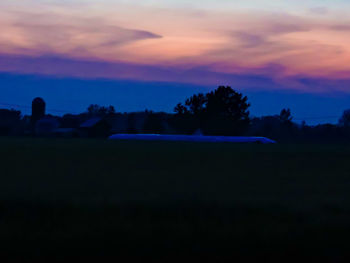 Scenic view of landscape at sunset