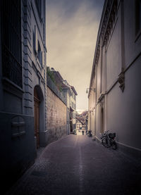 Street amidst buildings against sky