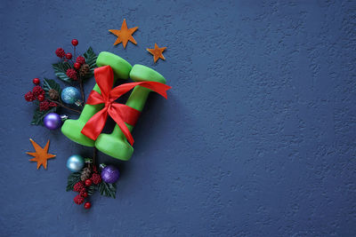 Close-up of christmas decoration on table against wall