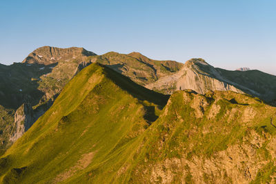 Scenic view of mountain range against clear sky