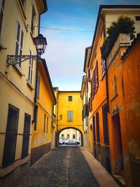 Narrow alley amidst buildings in city