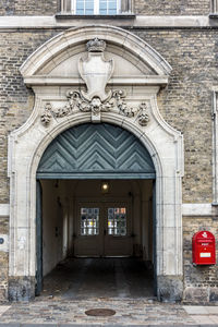 Entrance of historic building. red post box to the right.