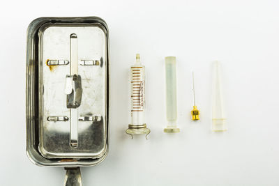 High angle view of electric lamp on table against white background