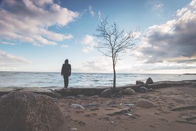 Scenic view of sea against cloudy sky