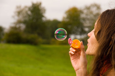 Woman holding bubbles