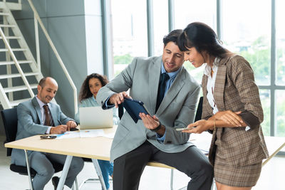 Business colleagues working at office