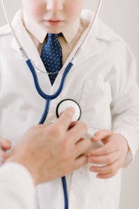 Child in labcoat with stethoscope