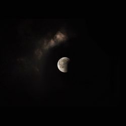 Low angle view of moon against sky at night