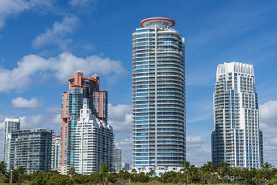 Modern buildings in city against sky