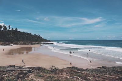 View of beach against cloudy sky