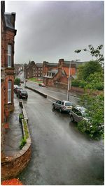 Road in city against sky