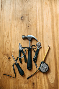 Directly above shot of equipment on wooden wall