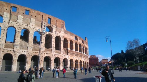 Tourists in front of building