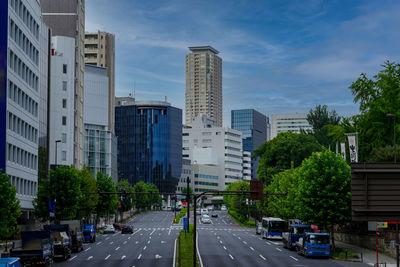 City street and buildings against sky. aoyama street 