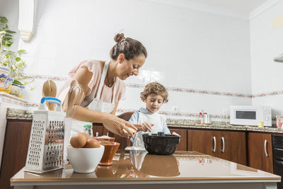 Father and son in kitchen