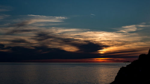 Scenic view of sea against sky during sunset