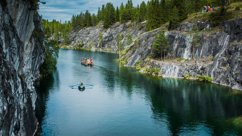 Scenic view of river against mountain