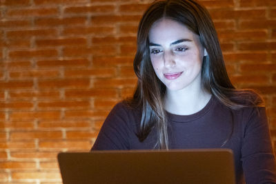 Young woman using digital tablet