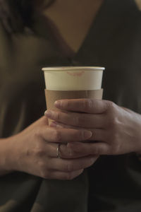 Close-up of woman holding coffee cup