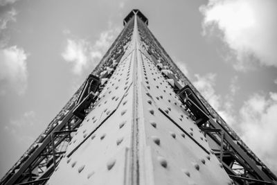 Low angle view of amusement park against sky