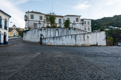 Street amidst buildings against sky