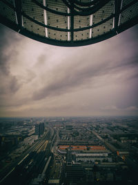 High angle view of cityscape against cloudy sky