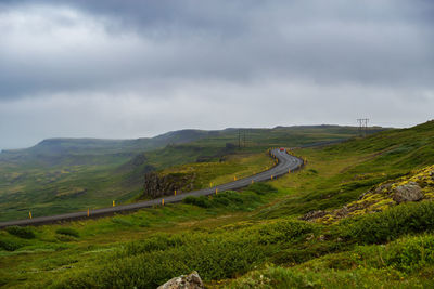 High angle view of mountain road against cloudy sky