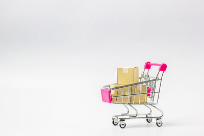 Close-up of pink equipment against white background