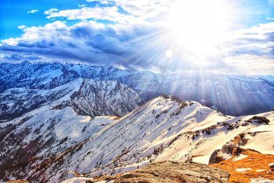 Scenic view of snowcapped mountains against sky