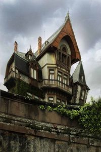 Low angle view of building against cloudy sky