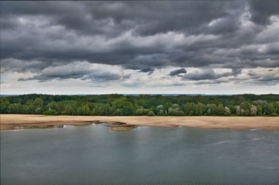 Scenic view of sea against cloudy sky