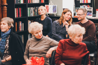 Group of people sitting at home