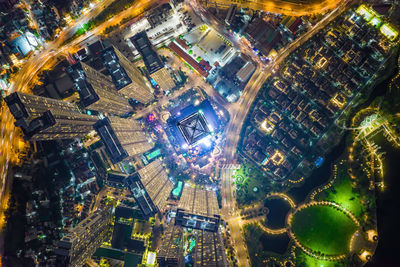 High angle view of illuminated buildings in city at night