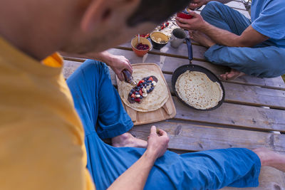 High angle view of man preparing food