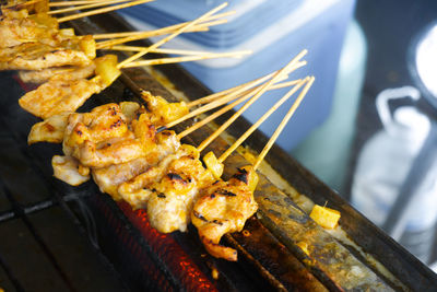 High angle view of meat on barbecue grill