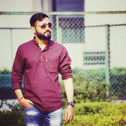 Young man wearing sunglasses standing outdoors