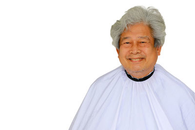 Portrait of smiling man against white background